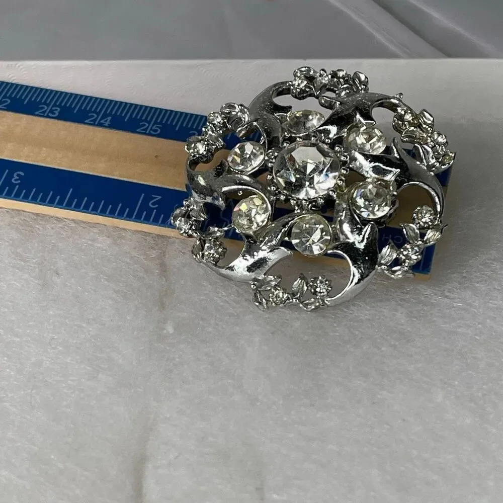 Vintage rhinestone swirl starbust open cut atomic area brooch. - Picture 6 of 7